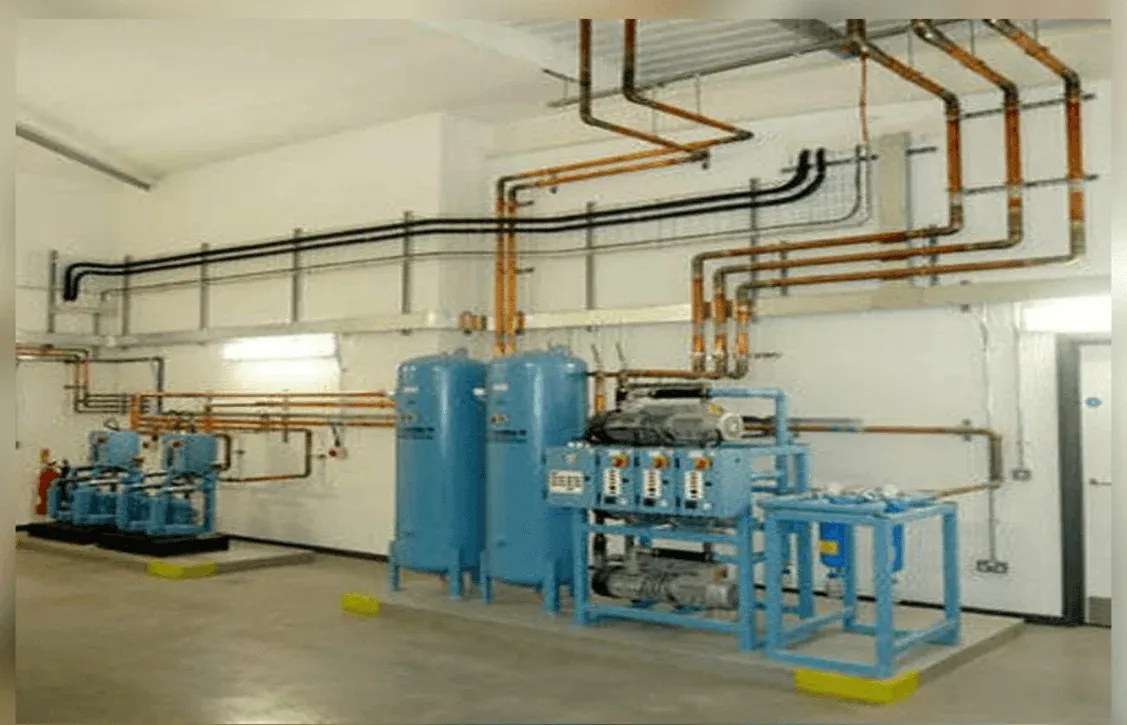 Medical gas plant room with medical air compressors, vacuum plant and cylinder manifold pipework